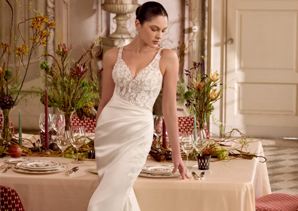 Model wearing a white gown by Justin Alexander