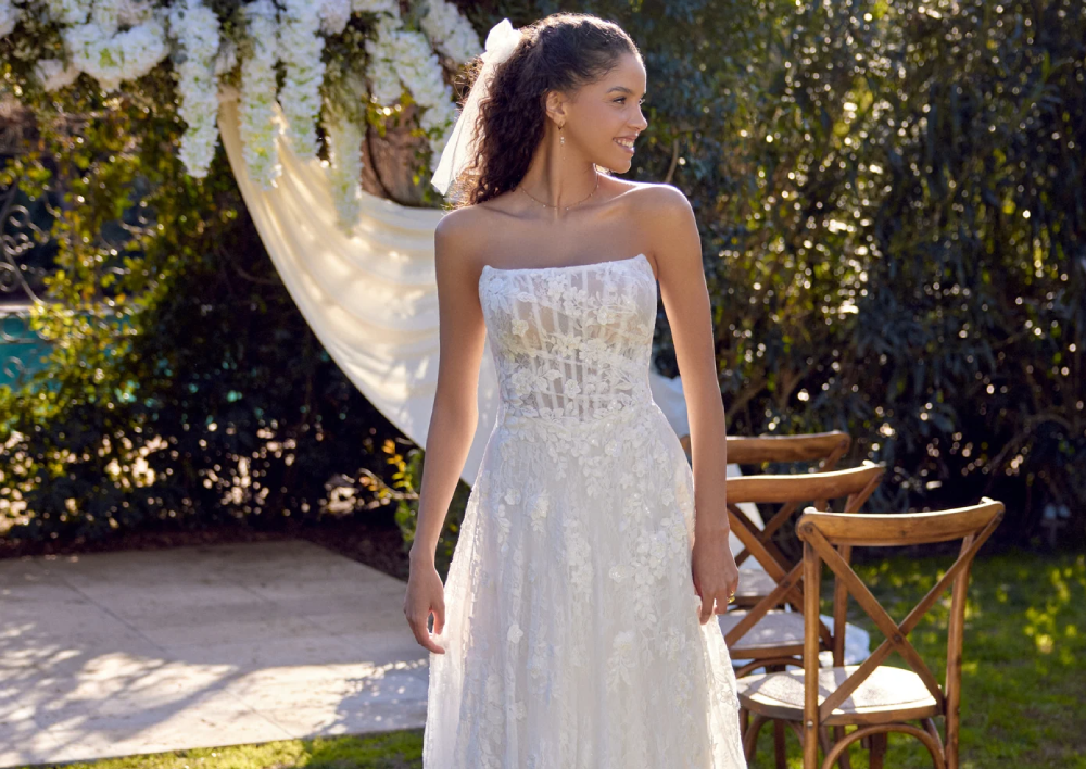Model wearing a white gown by Lillian West
