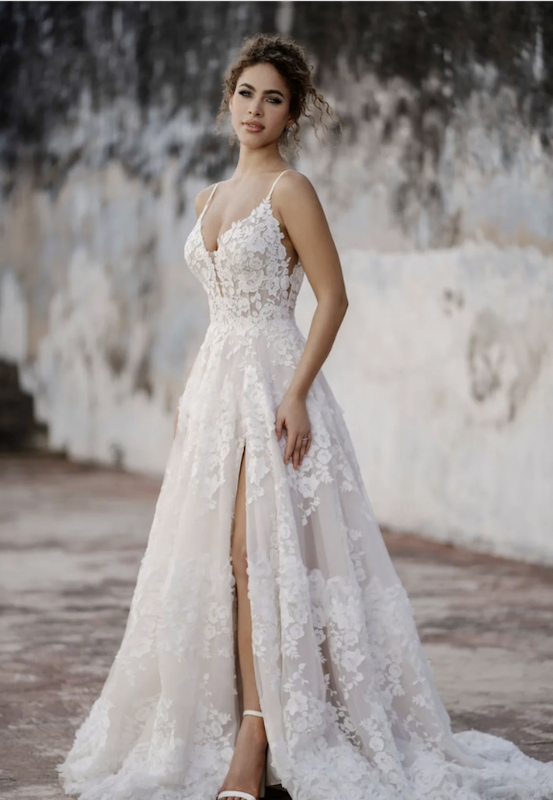 Model wearing a white gown by Justin Alexander