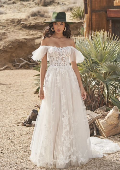 Model wearing a white gown by Lillian West