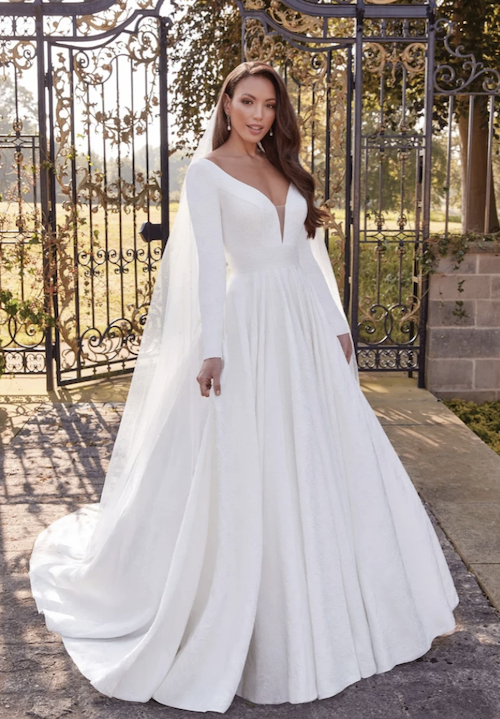 Model wearing a white gown by Sincerity