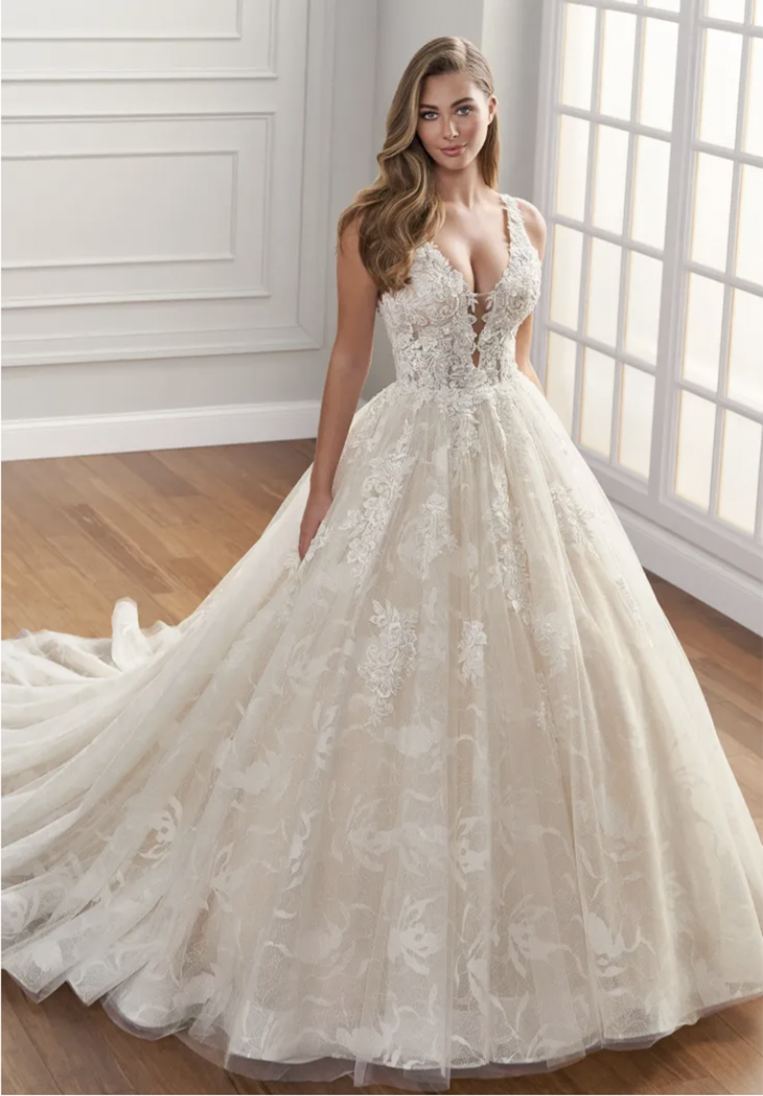 Blonde woman in ball style wedding gown with deep neckline