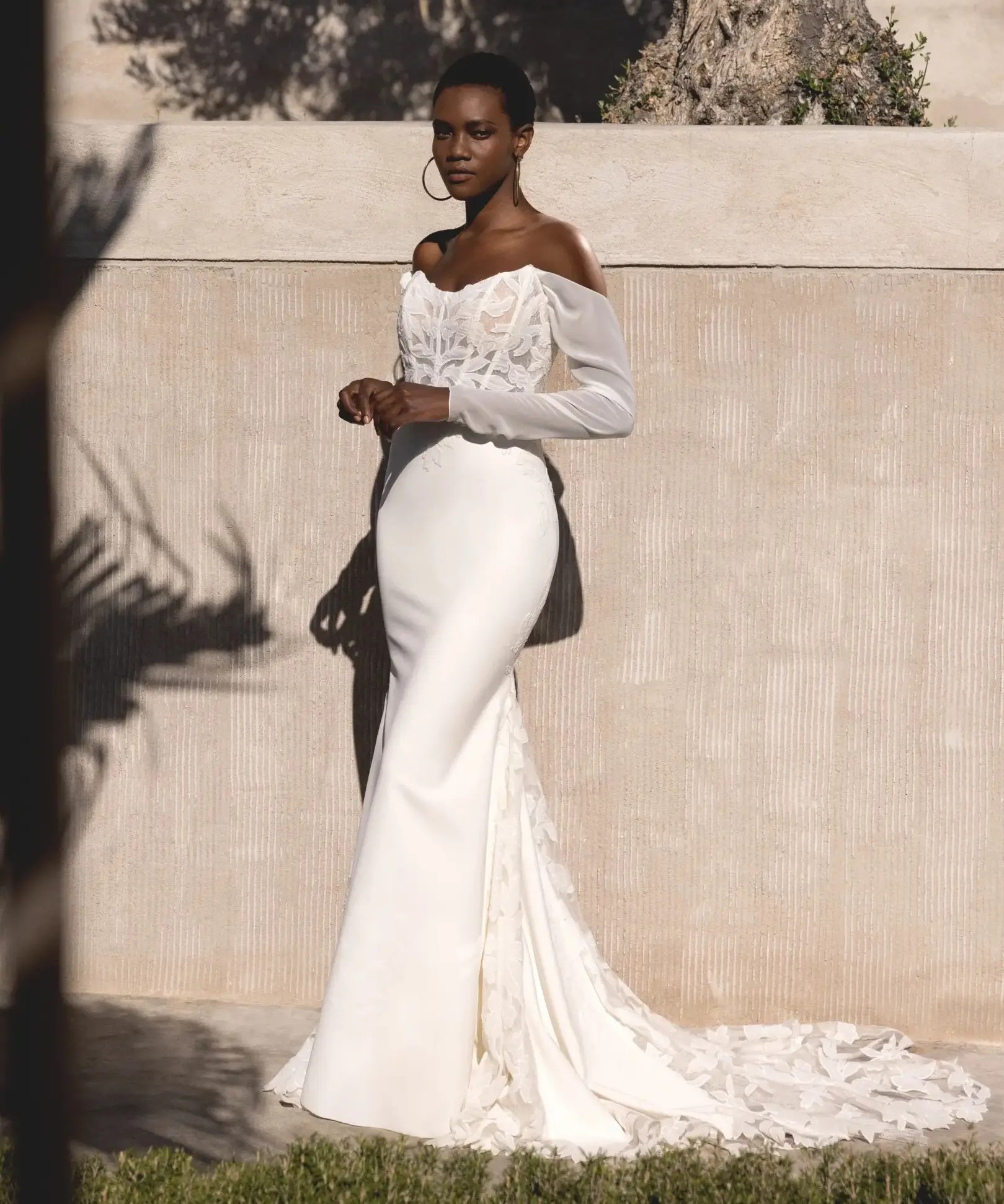 Woman with curly hair wearing boho V-Neck Tulle A-Line Bridal Dress with Sequined Lace Appliques