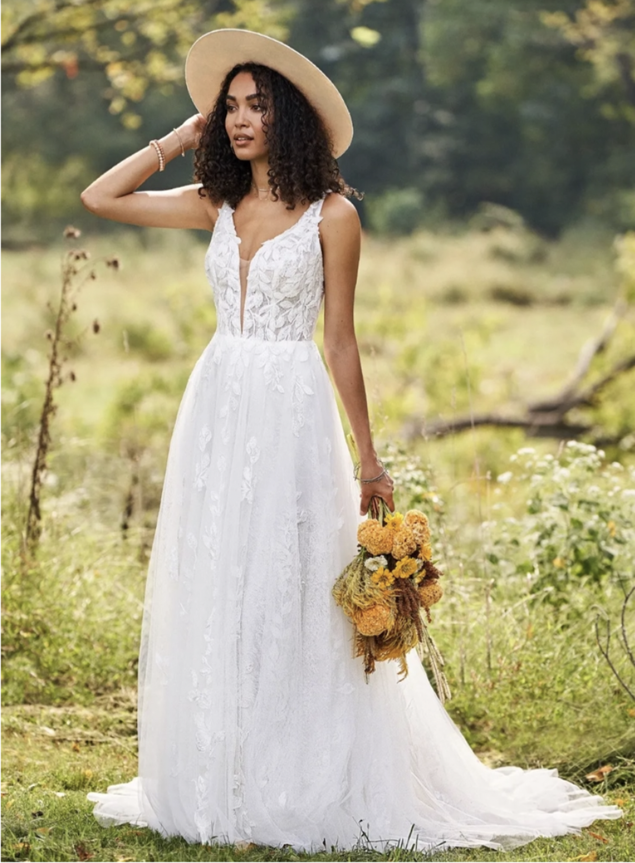 Woman with curly hair wearing boho V-Neck Tulle A-Line Bridal Dress with Sequined Lace Appliques